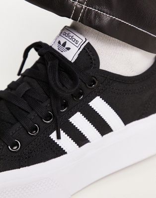 adidas originals nizza platform sneakers in black and white