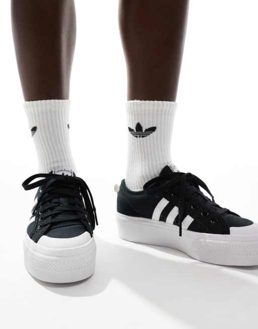 adidas Originals Nizza platform sneakers in black and white