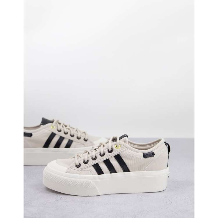 adidas Originals Nizza Platform trainers in off white with black
