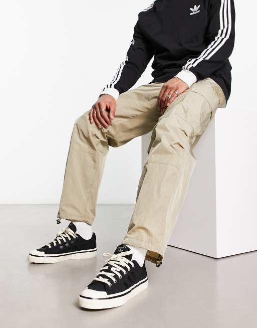 adidas Originals Nizza RF Sneakers in zwart en wit