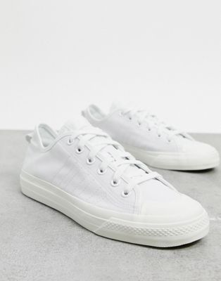 white canvas adidas trainers