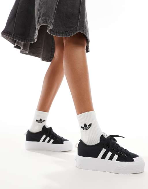 adidas Originals Nizza Sneakers nere e bianche con suola platform