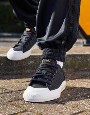 black adidas nizza trainers