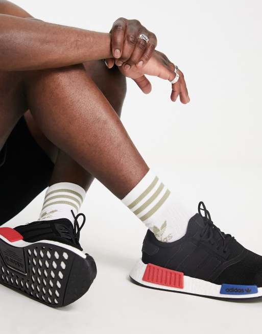 Adidas nmd nere store con schizzi