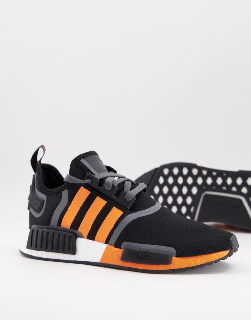 adidas Originals NMD R1 Sneaker in Schwarz mit orangefarbenen Streifen ASOS