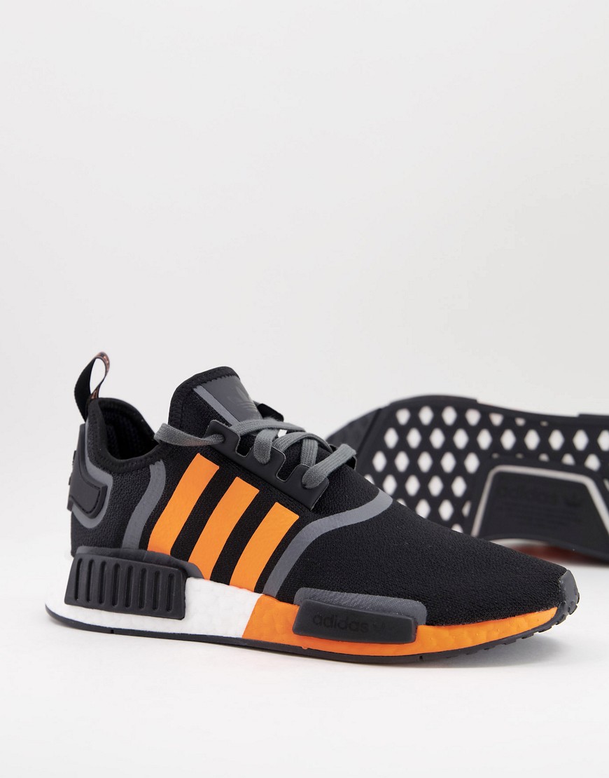 NMD_R1 sneakers in black with orange stripes