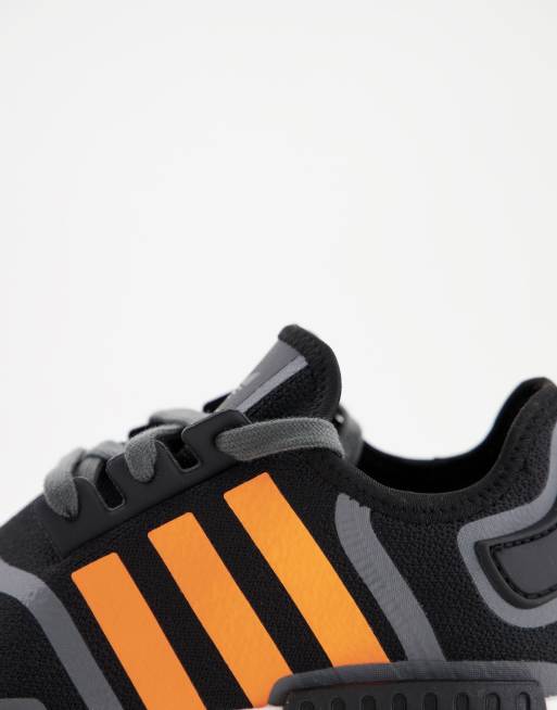 Adidas black with store orange stripes