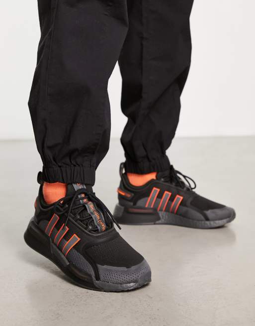 Adidas orange discount and black trainers