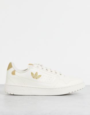 white and beige adidas trainers