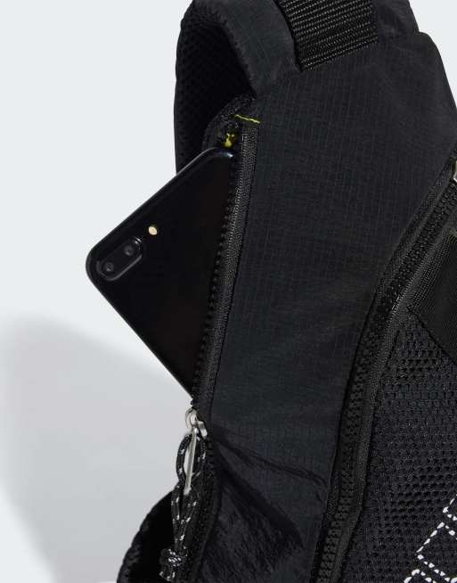 adidas Originals One-shoulder backpack in black shadow olive ASOS