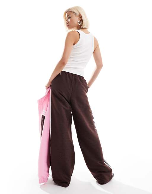 ウォーキング・ランニングウェア adidas monogram track pants y2k brown Men's Clothing - Monogram Track Pants - Brown | adidas Saudi Arabia