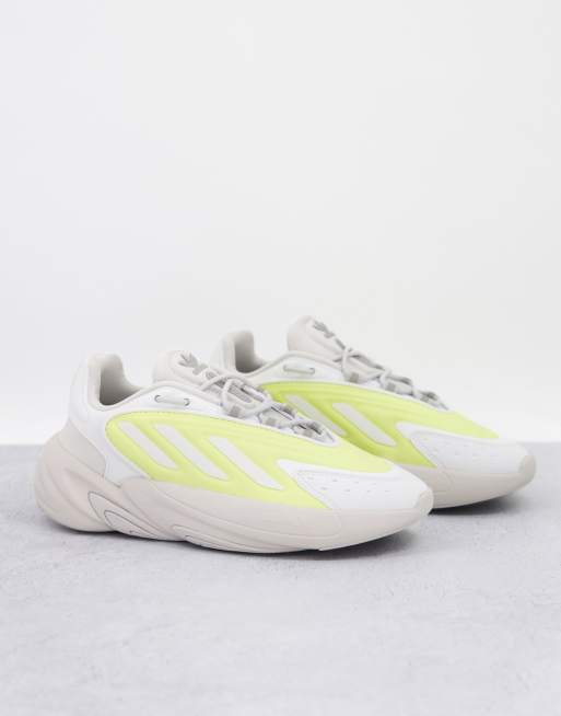 adidas Originals – Ozelia – Beige träningsskor med gula detaljer