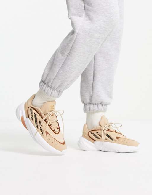 adidas Originals Ozelia sneakers with leopard stripes in beige | ASOS