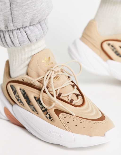 adidas Originals Ozelia sneakers with leopard stripes in beige | ASOS