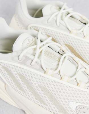 white and beige adidas trainers