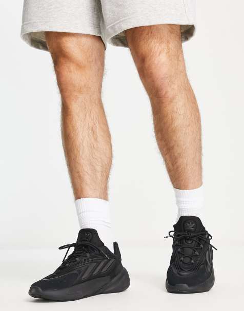 adidas Originals Ozelia trainers in triple black - view 1