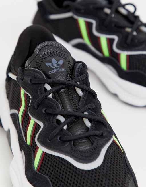 adidas Originals Ozweego sneakers in black and green