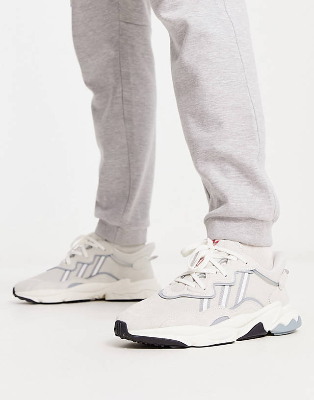 adidas Originals - ozweego trainers in off white and blue