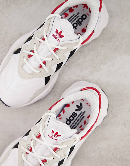 adidas Originals Ozweego trainers in white with heart print