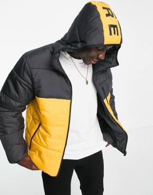 adidas Originals padded jacket in black and yellow