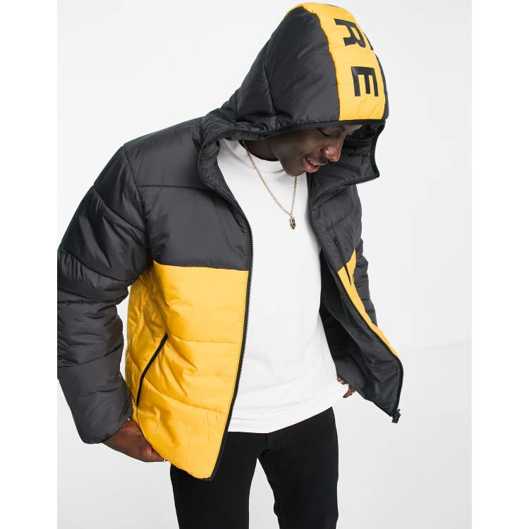 adidas Originals padded jacket in black and yellow ASOS