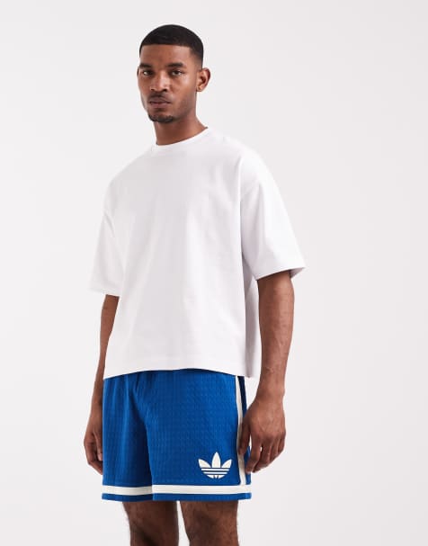 adidas Originals - Pantaloncini in warp knit blu scuro e bianchi - view 1