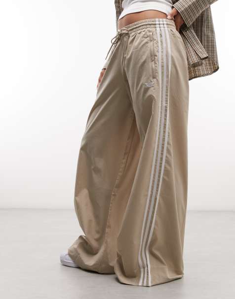 adidas Originals - pantalones de chándal tejidos Firebird en caqui claro - view 1