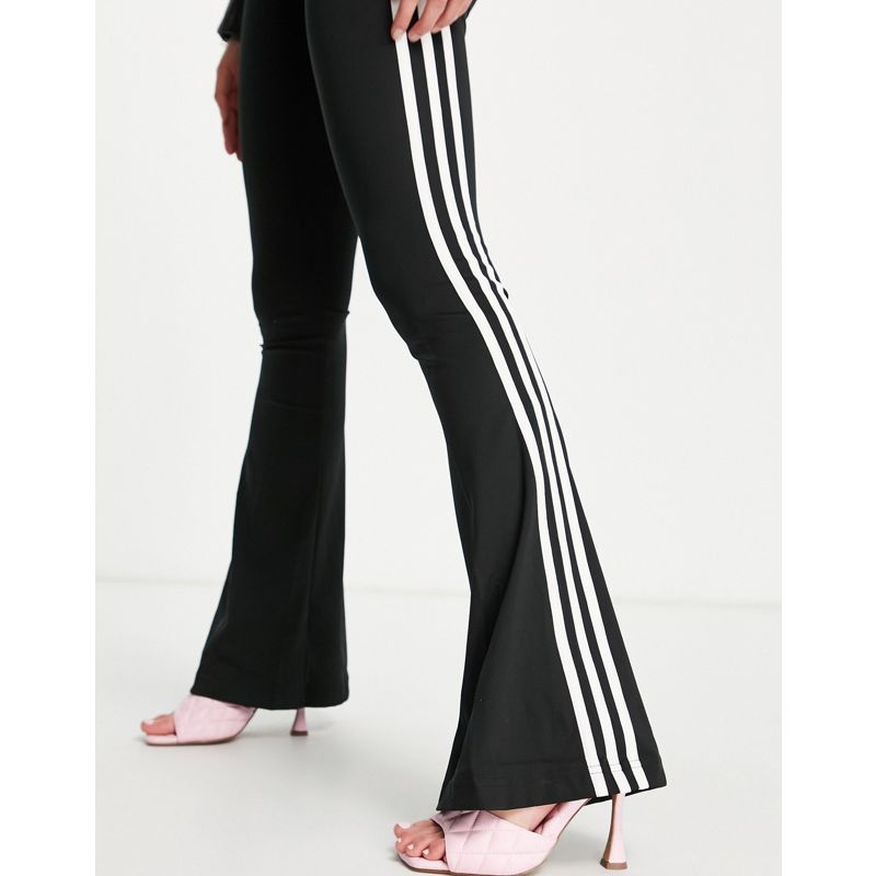 Joggers Tute adidas Originals - Pantaloni della tuta neri a zampa con le tre strisce