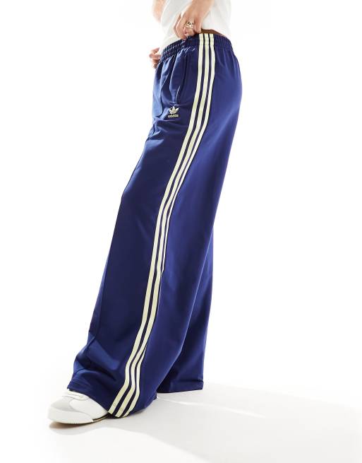 adidas Originals Pantaloni sportivi blu navy e gialli con tre strisce