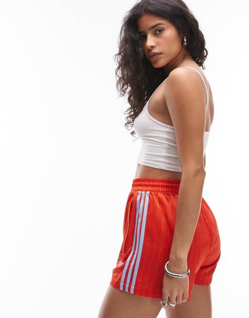 adidas Originals pinstripe satin shorts in orange and blue