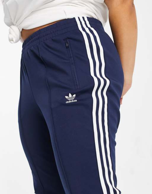 adidas Originals Plus logo three stripe track pants in navy ASOS