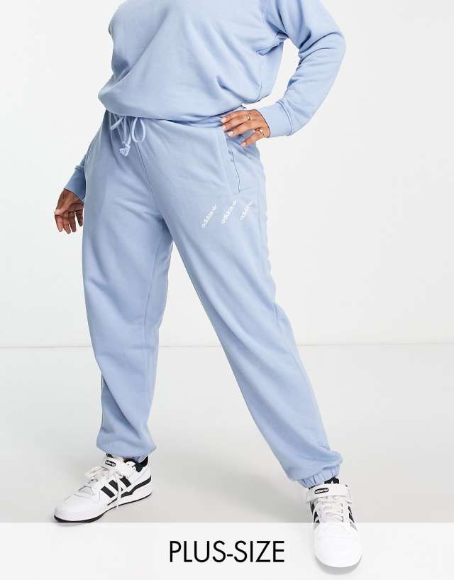 adidas Originals Plus Logomania triple logo joggers in light blue - MBLUE