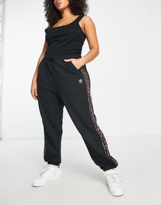 adidas Originals Plus trackies with leopard print three stripe in black