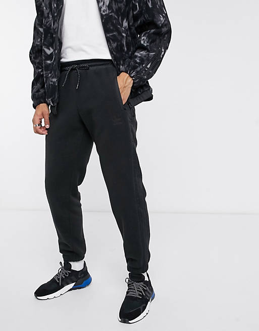 adidas Originals polar fleece sweatpants with reflective details in black tech pack