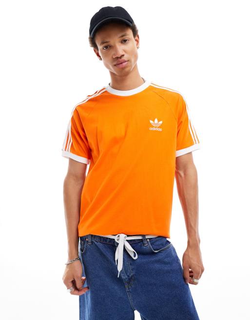 adidas Originals – Pomarańczowy T-shirt z trzema paskami