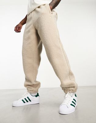adidas Originals Premium Essentials teddy fleece joggers in beige - ASOS Price Checker