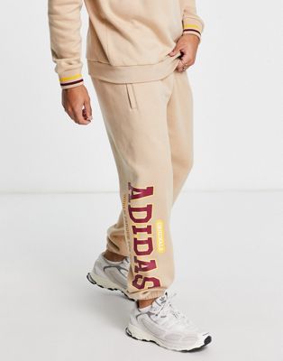 adidas Originals 'Preppy Varsity' large logo oversized joggers in beige