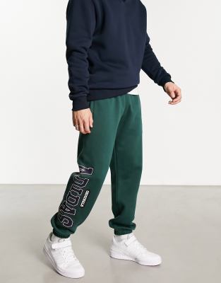 adidas Originals Preppy Varsity large logo oversized sweatpants in dark green