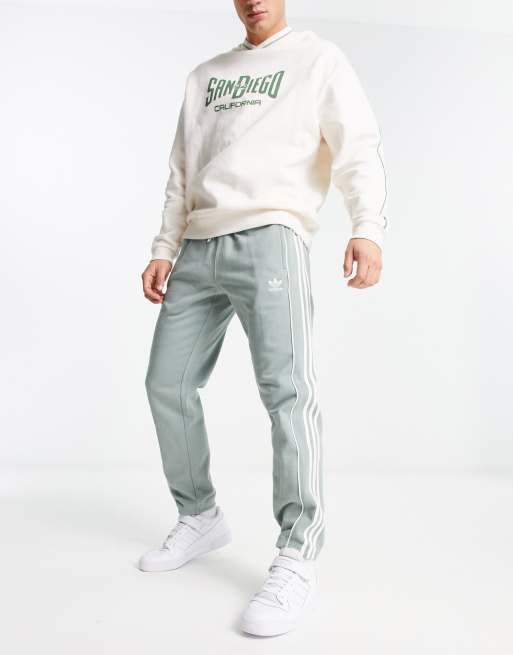 Adidas originals cuffed sweatpants with 3 store stripe logo