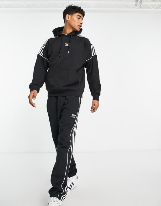 adidas Originals Rekive 3 stripe logo trackpants in black | ASOS