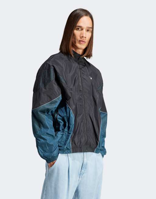 adidas Originals - Rekive - Geweven trainingstop in zwart/donkerblauw