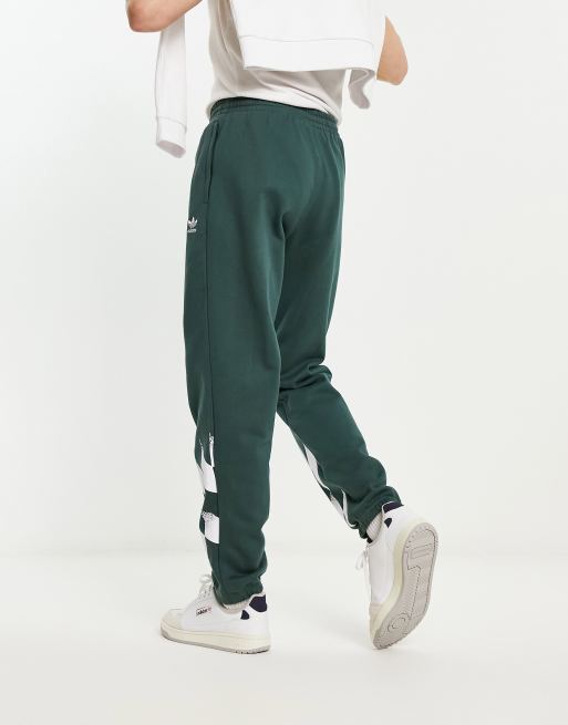 adidas Originals Rekive sweatpants in dark green and white |