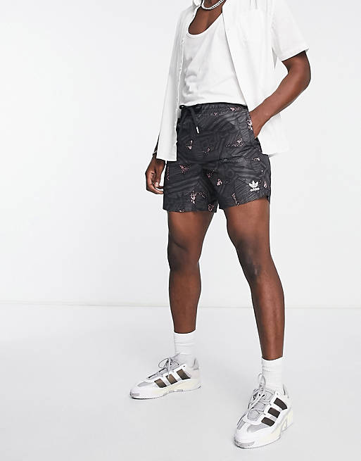 adidas Originals Rekive swim shorts in black with all-over Trefoil print |  ASOS