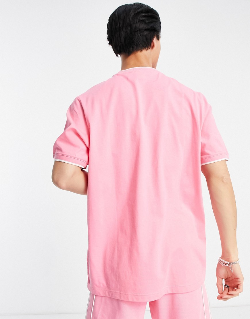 Rekive - T-shirt rosa con logo centrale - adidas Originals T-shirt donna  - immagine1
