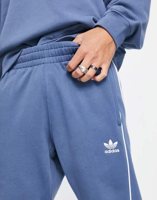 Adidas 3 stripe blue best sale track pants