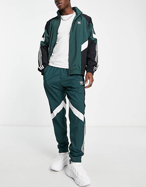 adidas Originals Rekive woven track pants light green with graphic detail