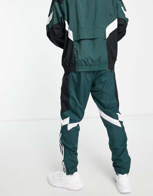 adidas Originals Rekive woven track pants in light green with