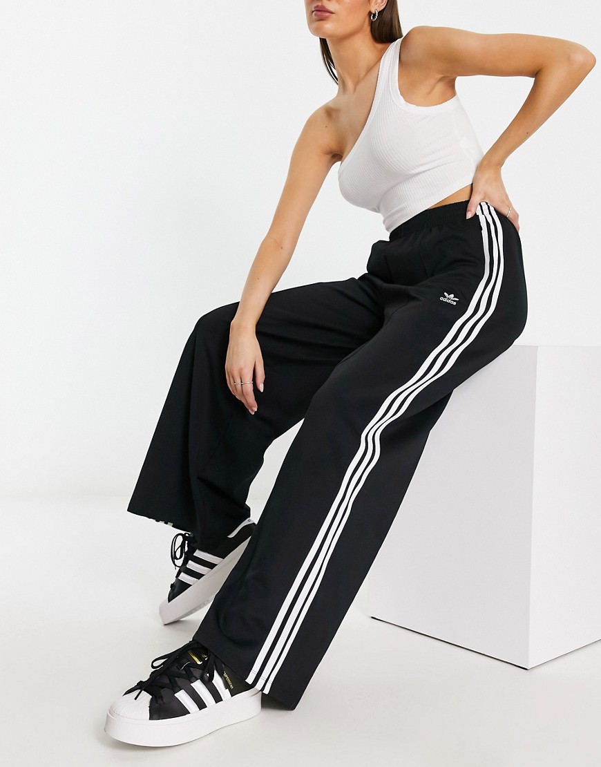 Adidas Originals Buttoned Three-stripe Track Pant In Black