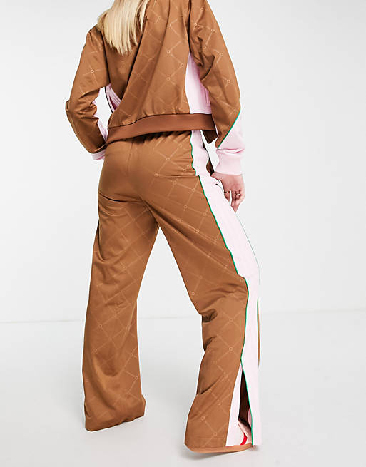 https://images.asos-media.com/products/adidas-originals-retro-luxury-track-pants-in-brown-with-monogram-print/202032068-4?$n_640w$&wid=513&fit=constrain