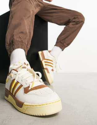 adidas Originals Rivalry Low sneakers in white and brown | ASOS